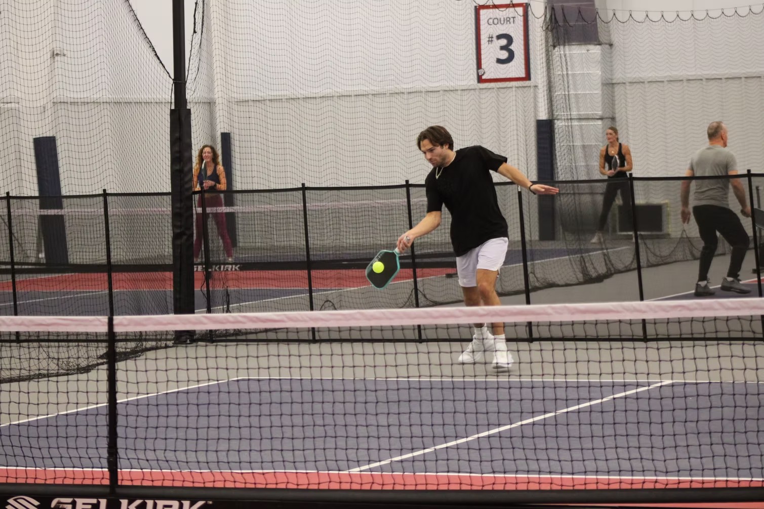 League players competing on LTP Pickleball's courts